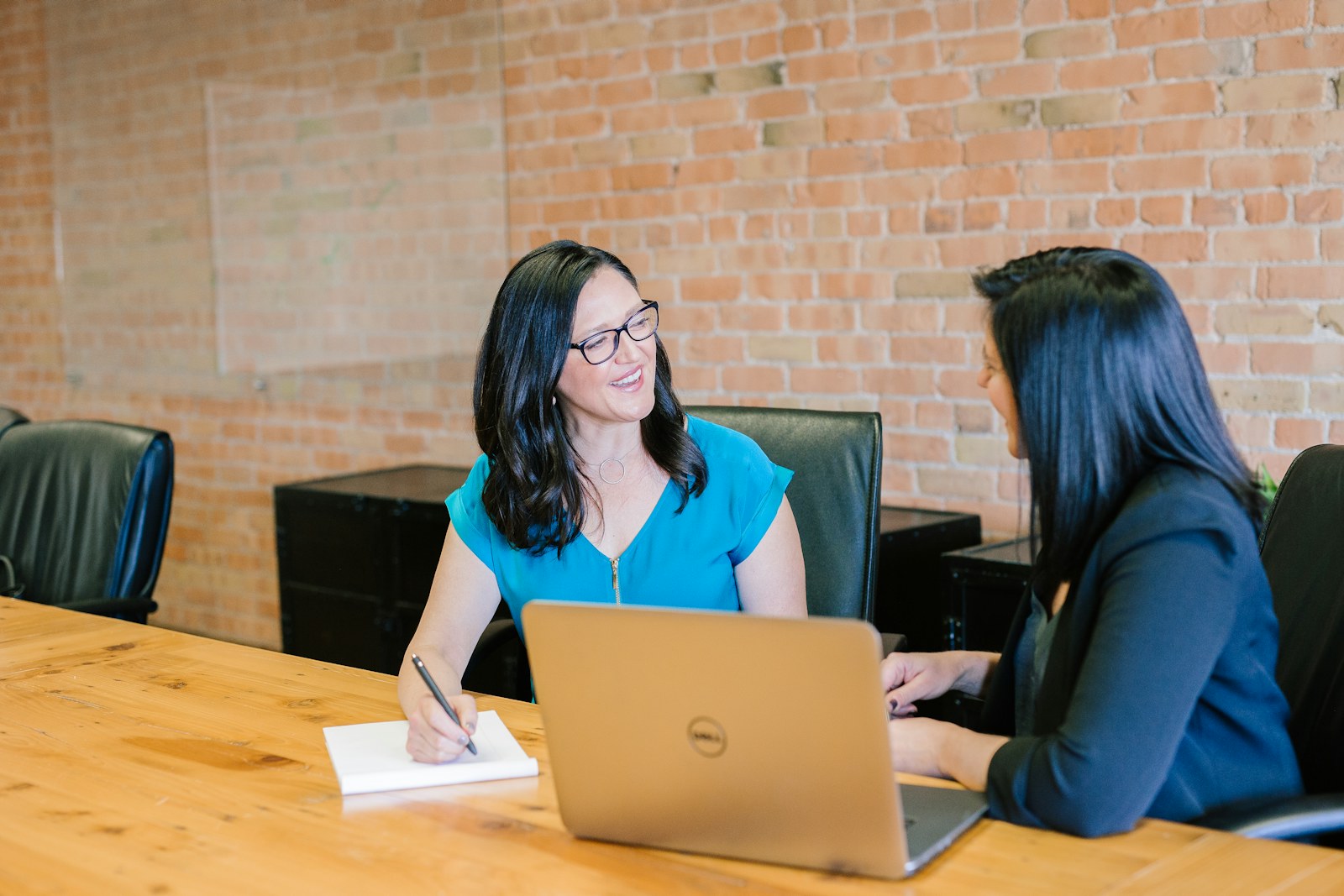 Two colleagues discussing a customer project